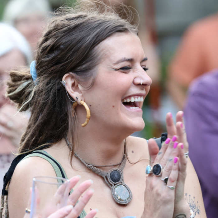 group of people smiling and clapping