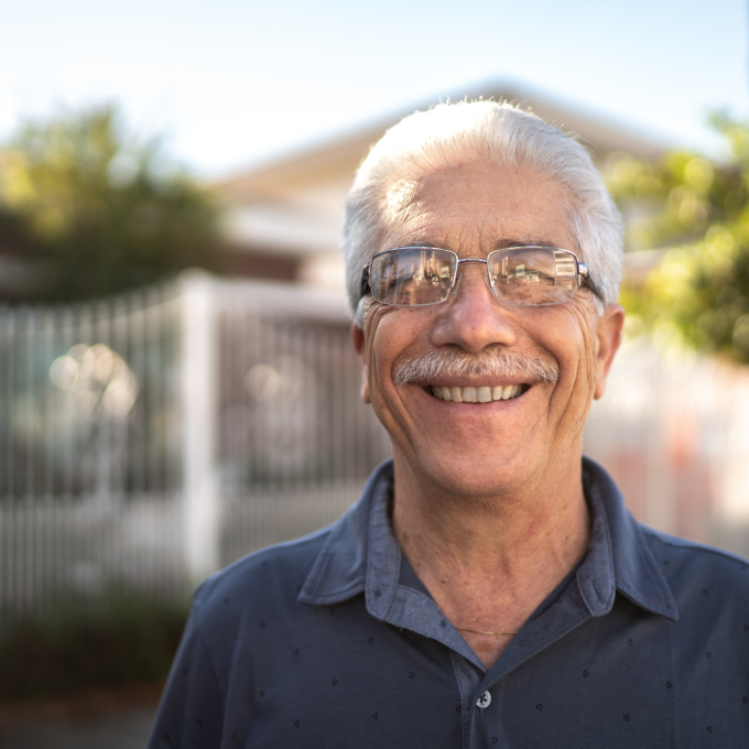Elderly man smiling at the camera
