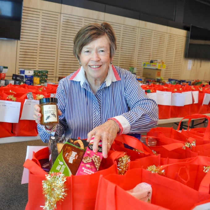Woman smiling with hampers